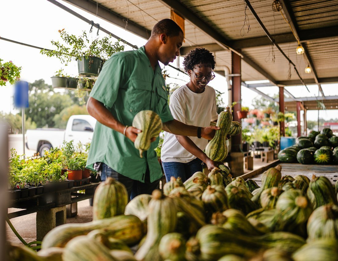 Couple shopping for fresh produce at a market